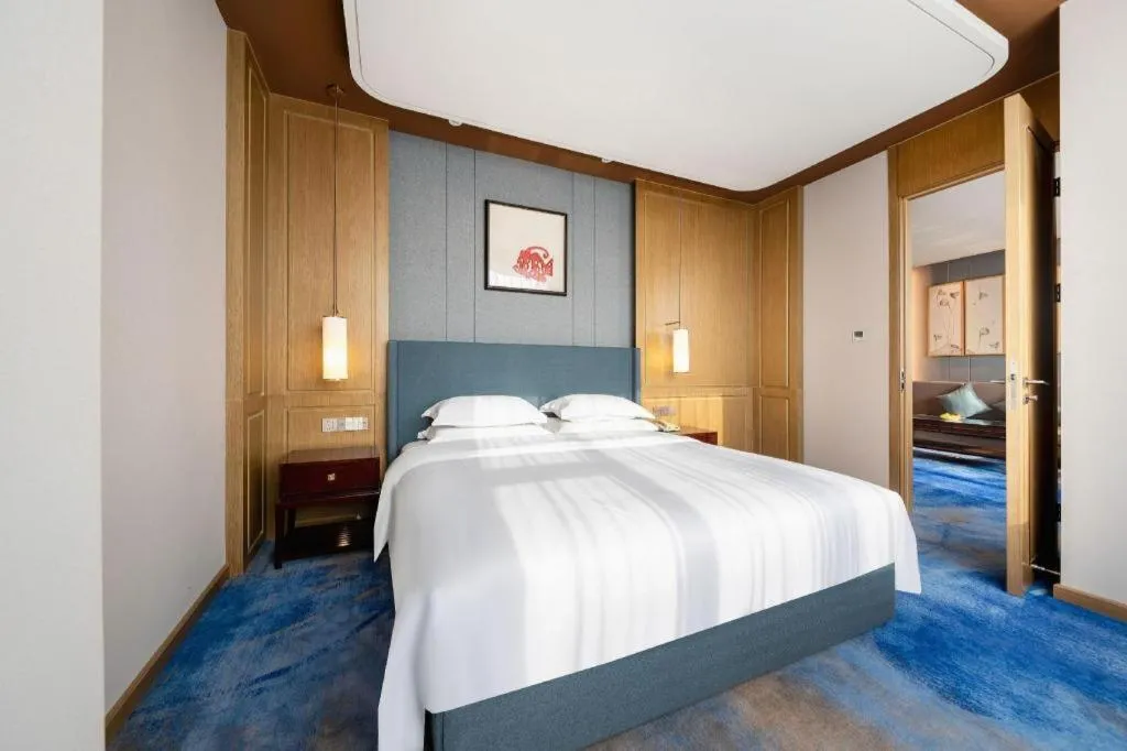 Bed in Bliss International Hotel Weihai