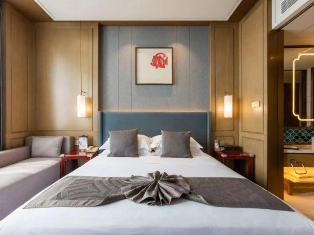 Bed in Bliss International Hotel Weihai