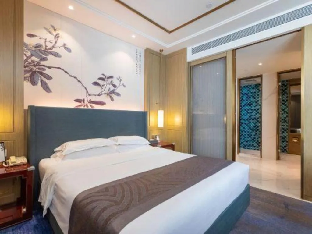 Bed in Bliss International Hotel Weihai