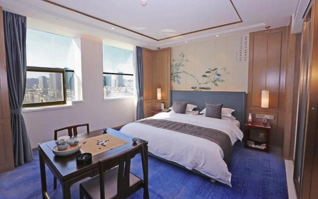Bed in Bliss International Hotel Weihai