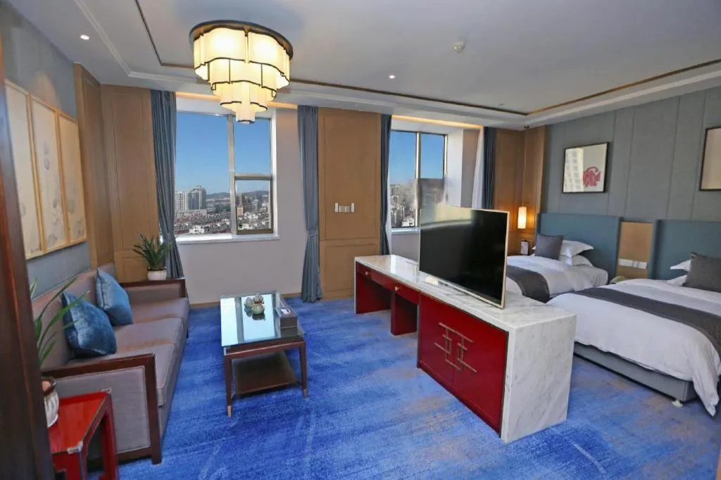 Bed in Bliss International Hotel Weihai