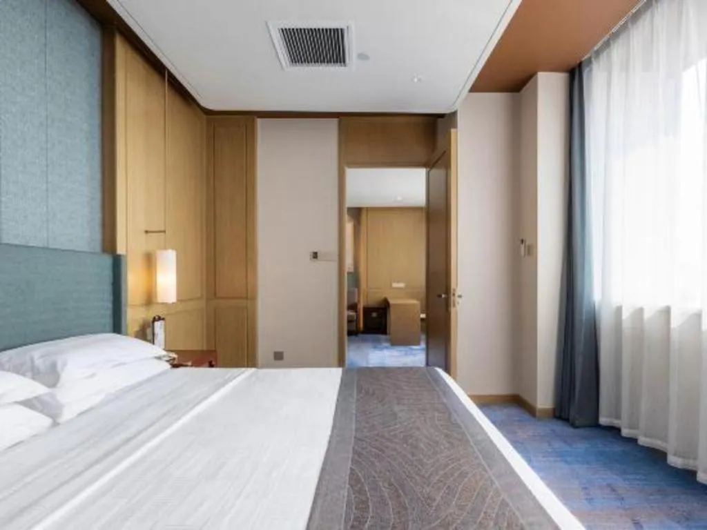 Bed in Bliss International Hotel Weihai