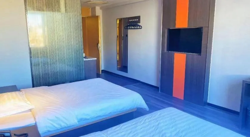 Bed in IU Hotel Tianjin Tianta Scenic Spot Wujiayao Metro Station