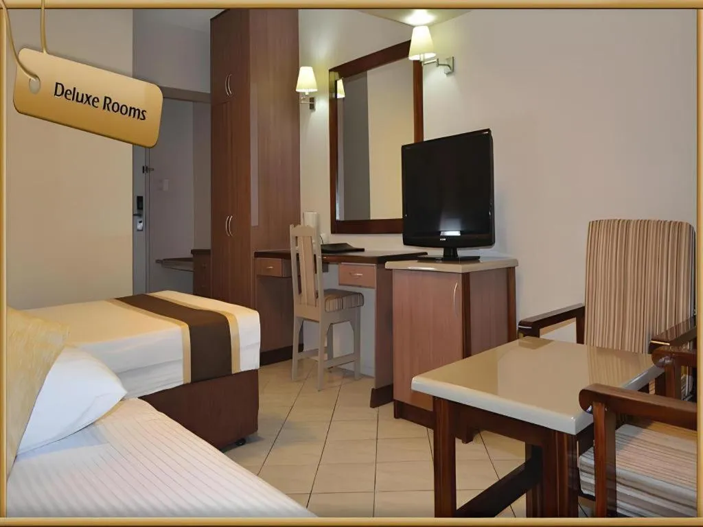 Bed in Peninsula International Hotel