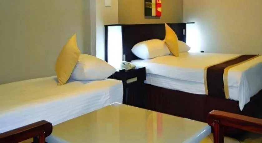 Bed in Peninsula International Hotel
