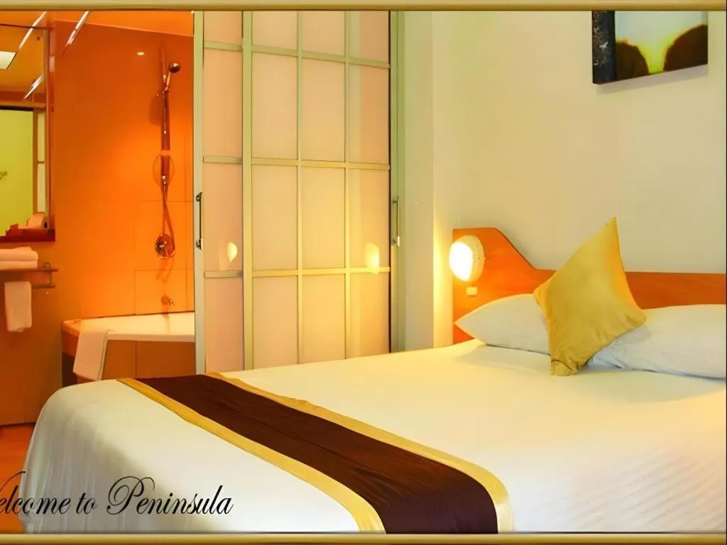 Bed in Peninsula International Hotel
