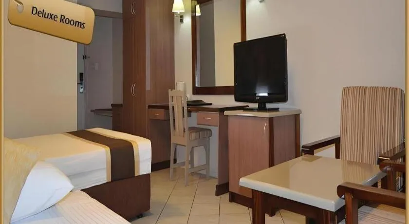 Bed in Peninsula International Hotel