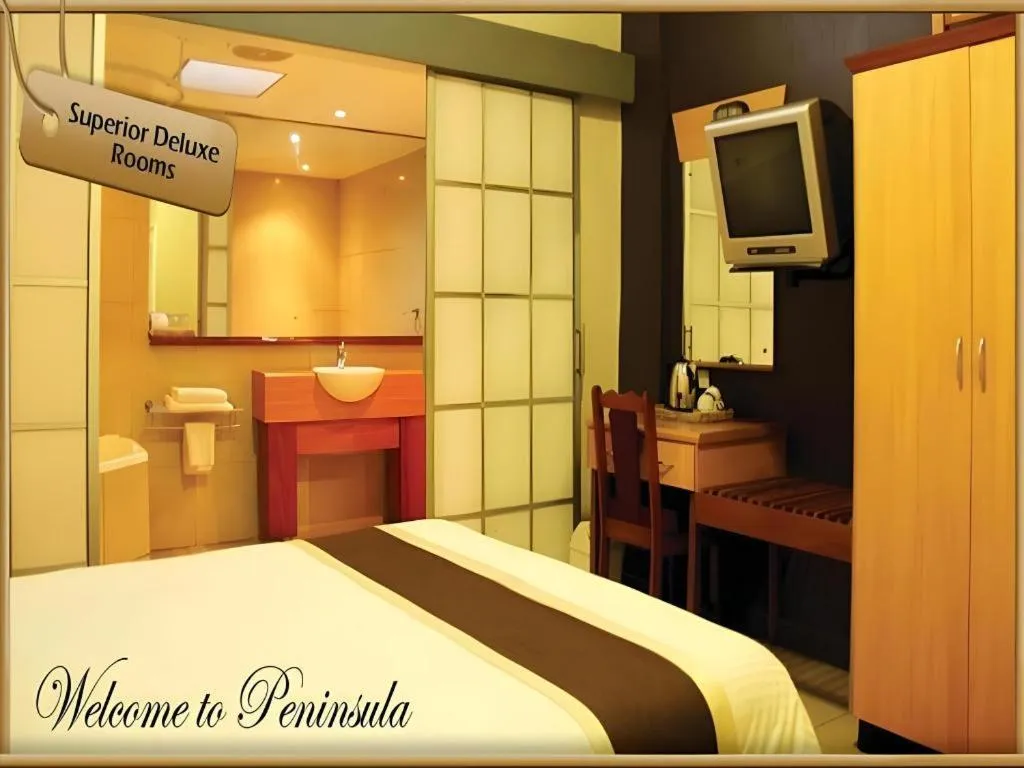 Bed in Peninsula International Hotel