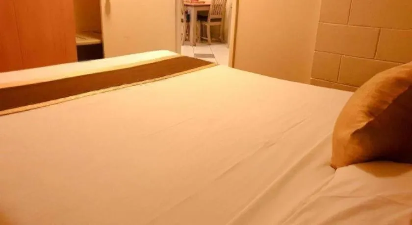 Bed in Peninsula International Hotel