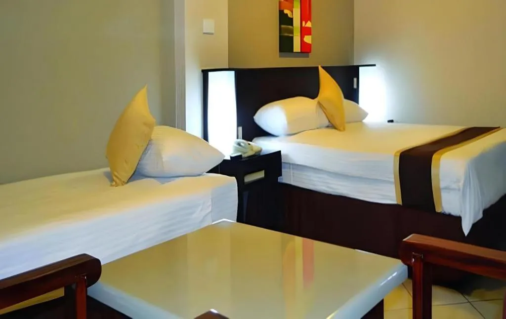 Bed in Peninsula International Hotel