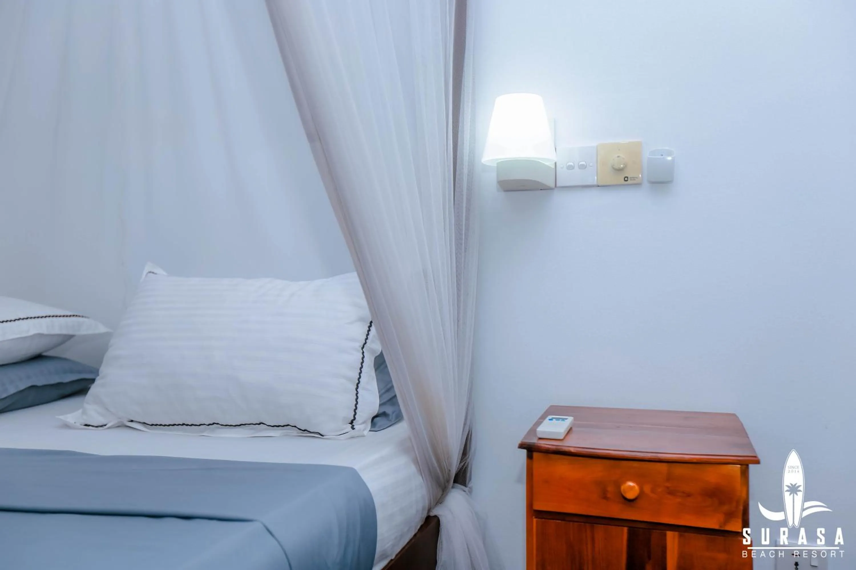 Bed in Surasa Beach Resort