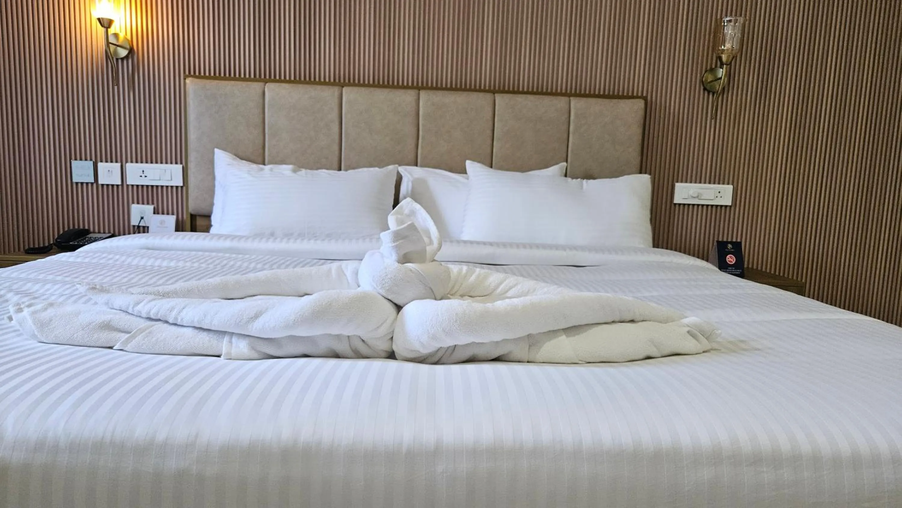 Bed in Prosland Hotel