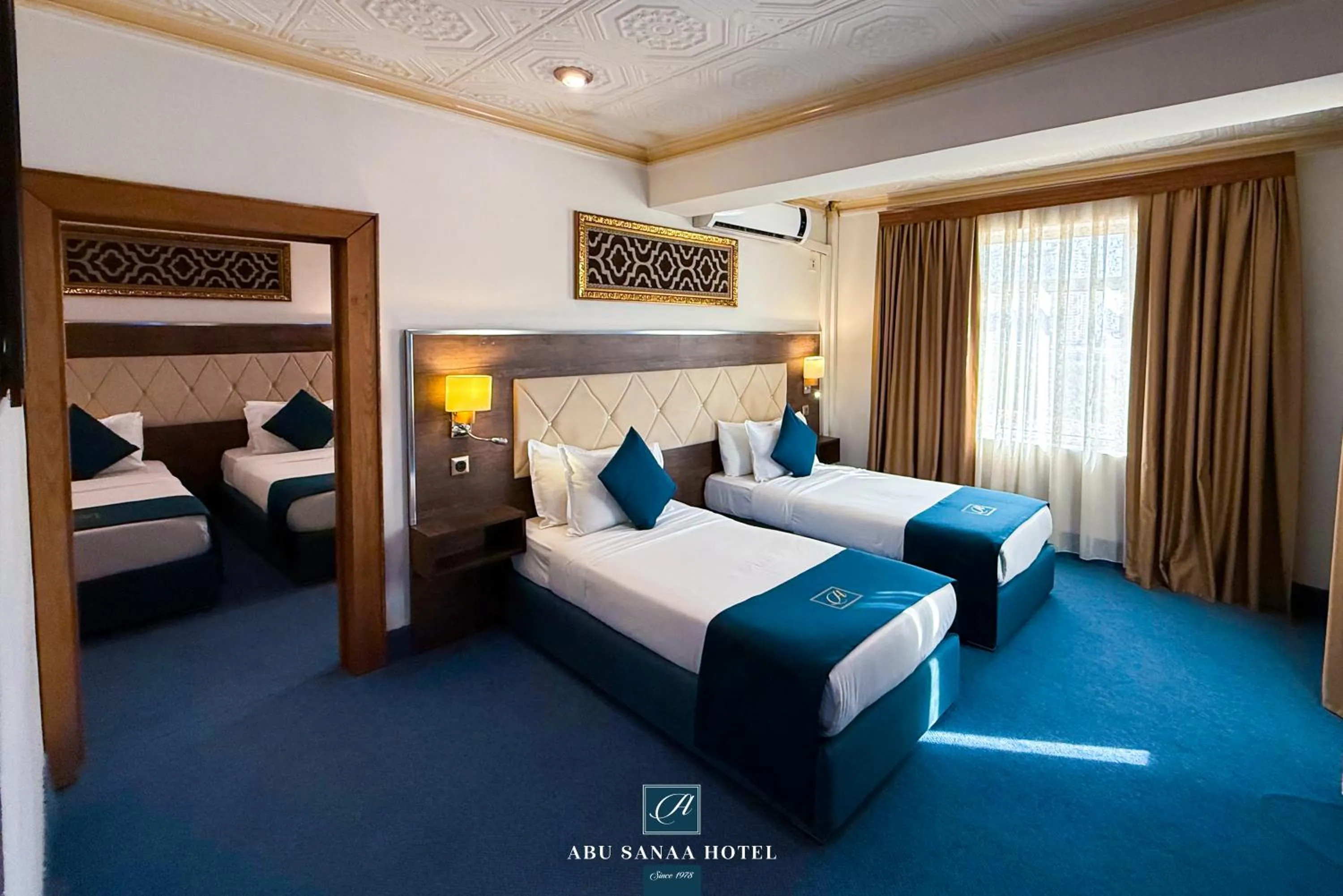 Bed in Abu Sanaa Hotel