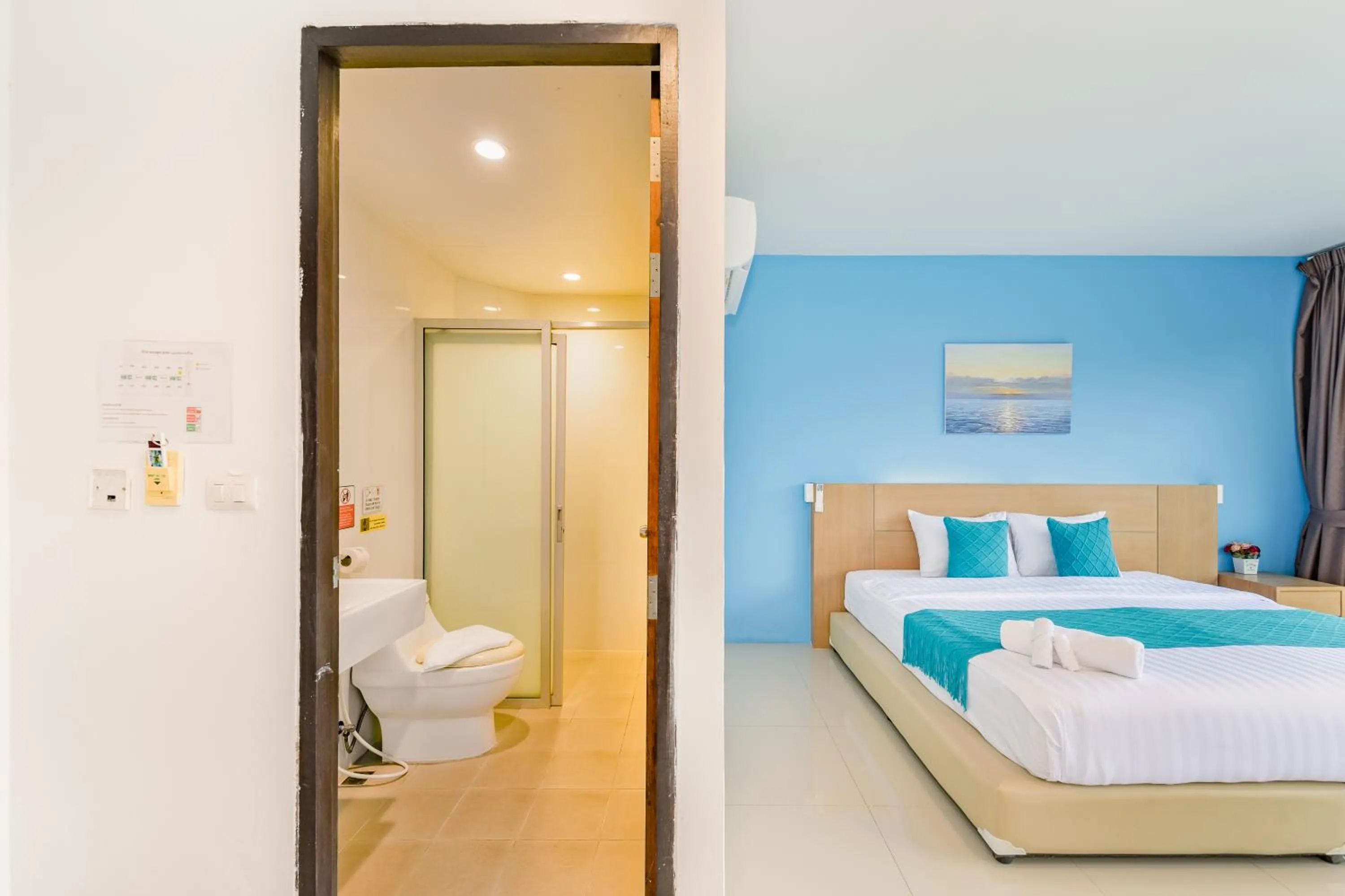 Bed in De Blue Sea Rawai Hotel