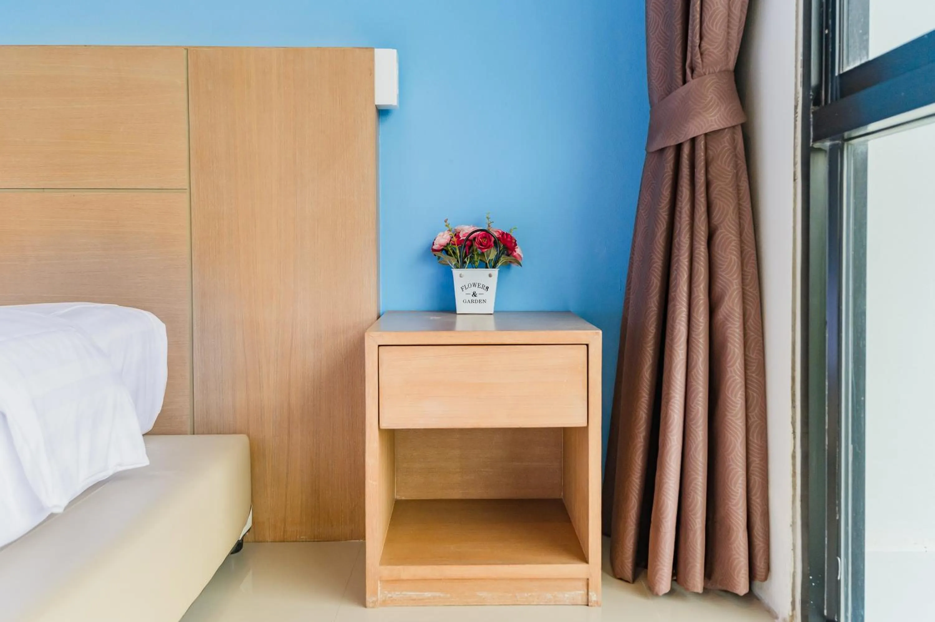 Bed in De Blue Sea Rawai Hotel