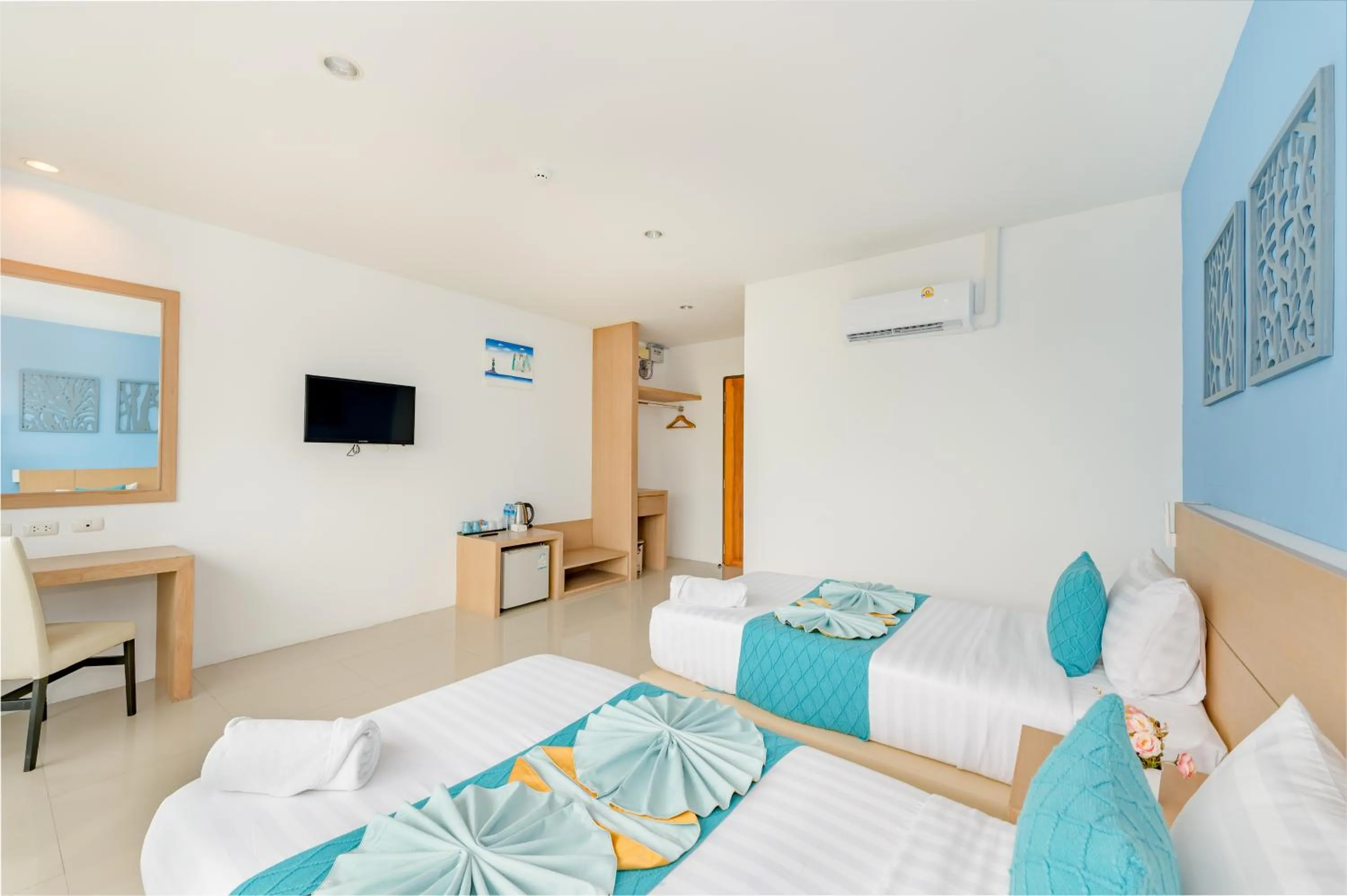 Bed in De Blue Sea Rawai Hotel