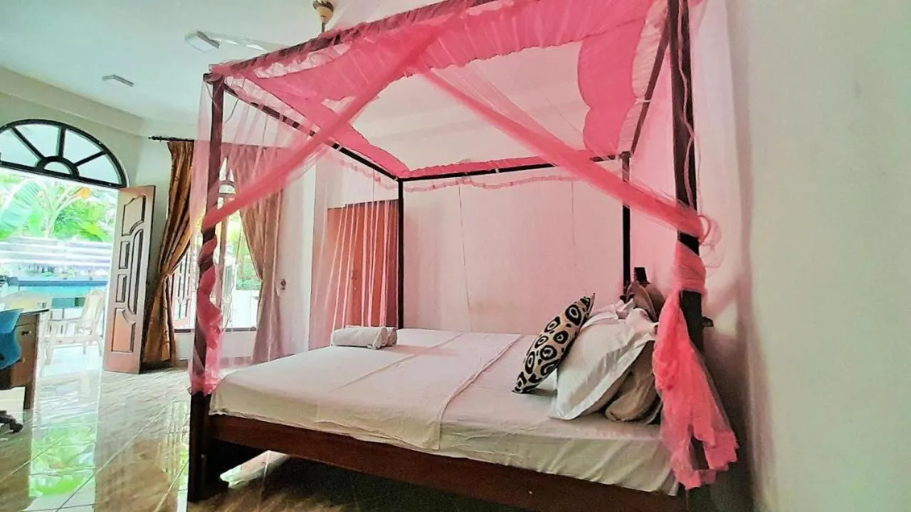 Bed in Bentota River Dilu Villa
