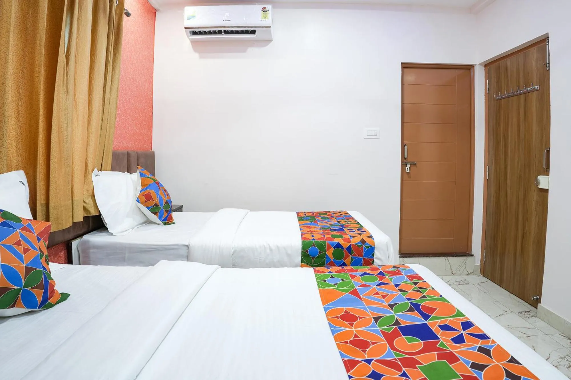 Bed in FabHotel A White Pearl Suites - Yelahanka