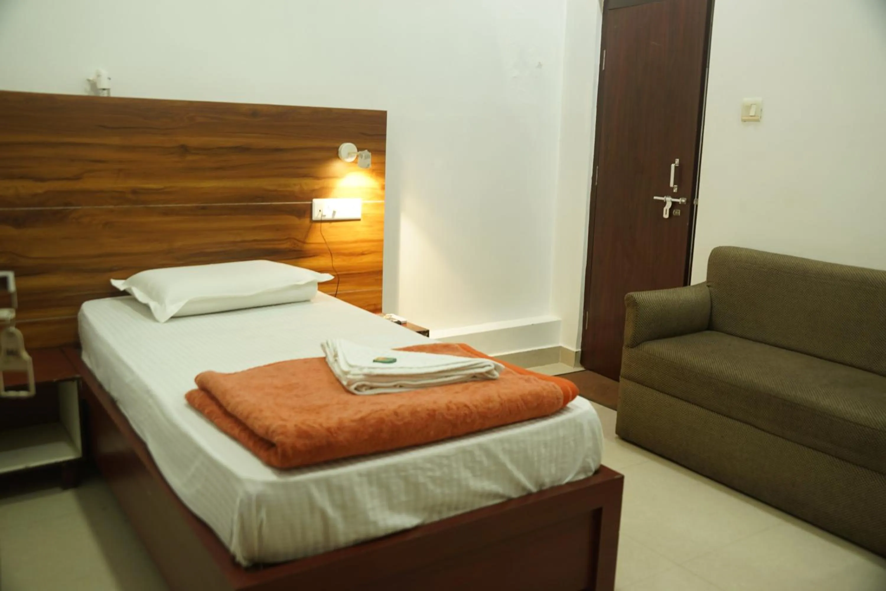 Bed in Subhash Hotel