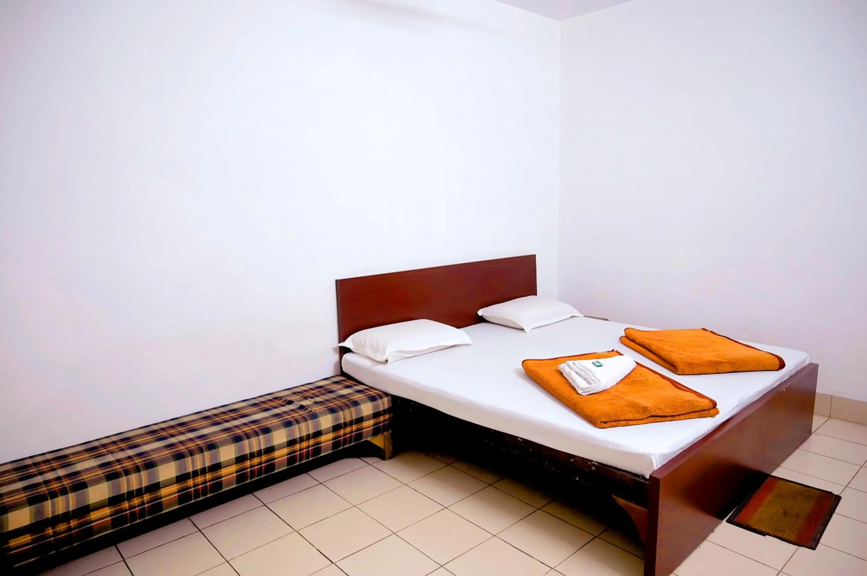 Bed in Subhash Hotel