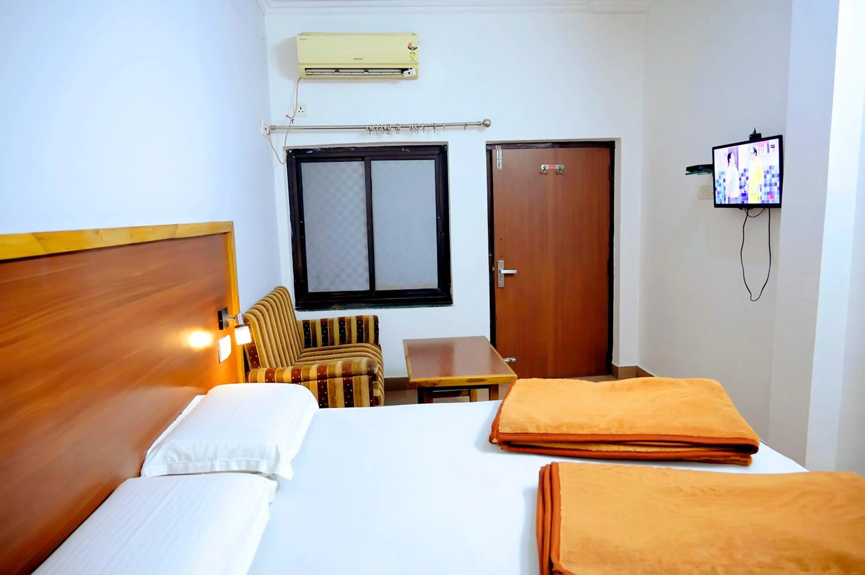 Bed in Subhash Hotel