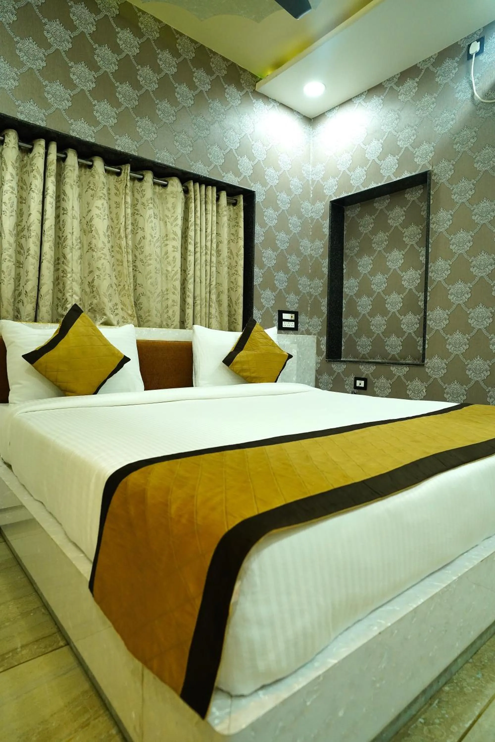 Bed in THE MANTRA- A Luxury Boutique Hotel
