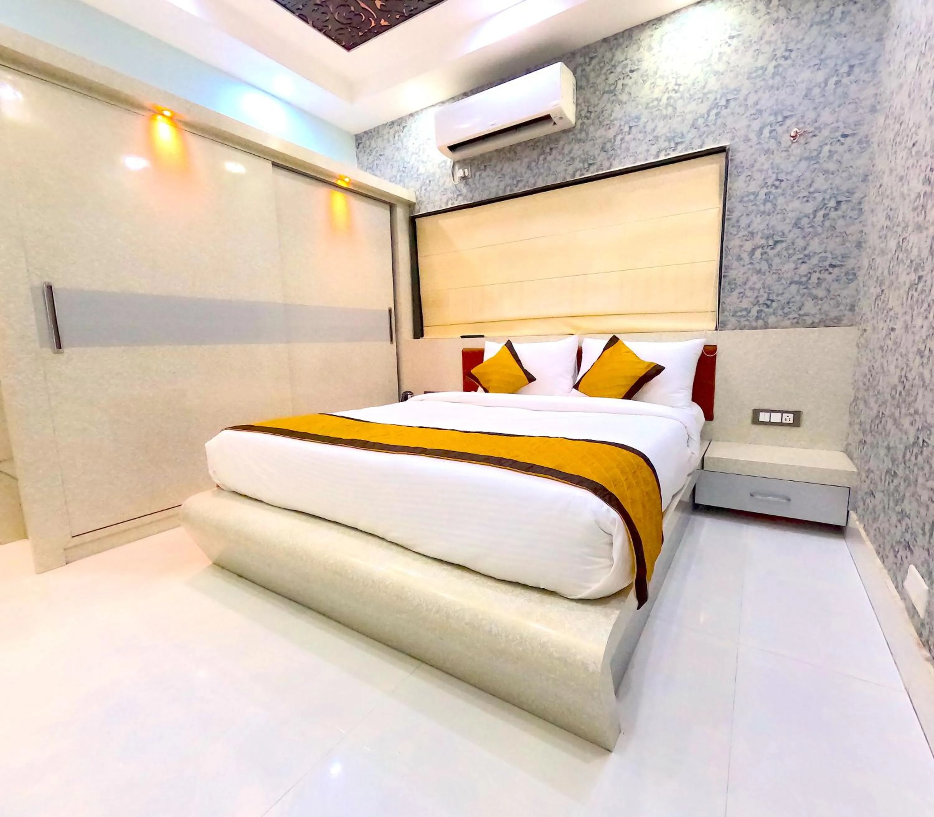 Bed in THE MANTRA- A Luxury Boutique Hotel