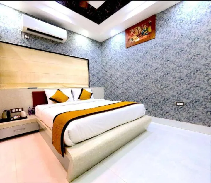 Bed in THE MANTRA- A Luxury Boutique Hotel
