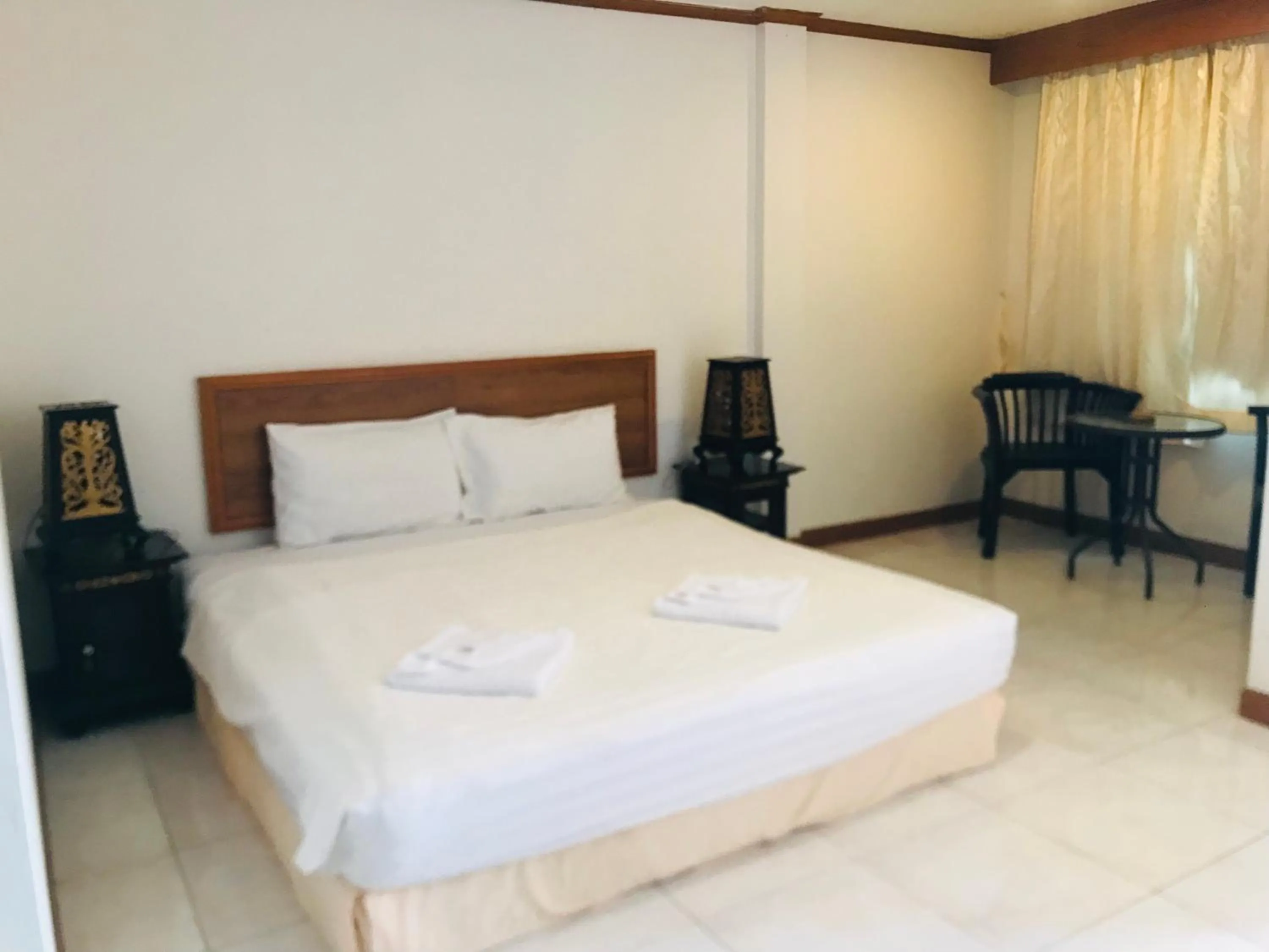 Bed in Global Hotel Beach View