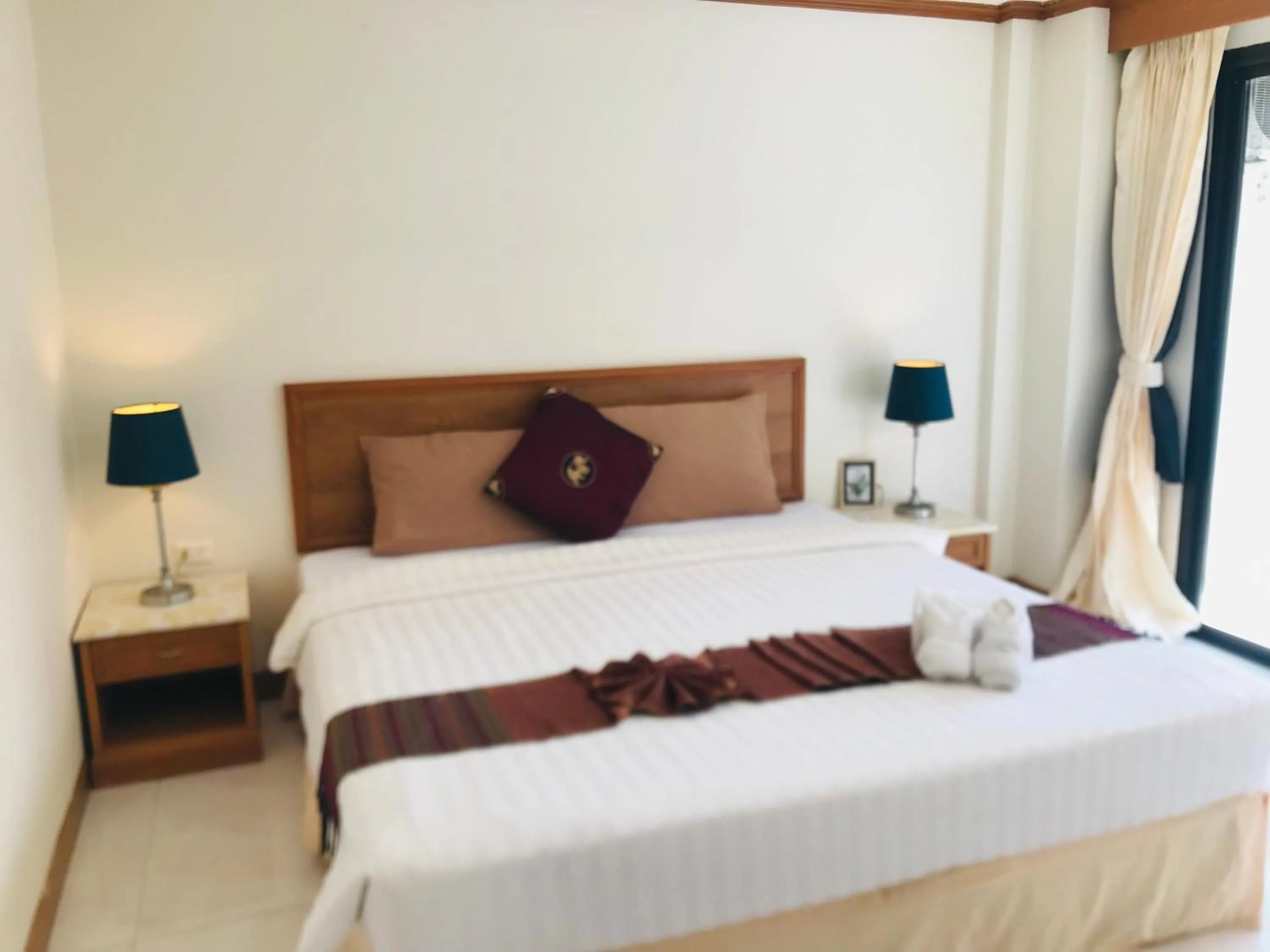 Bed in Global Hotel Beach View