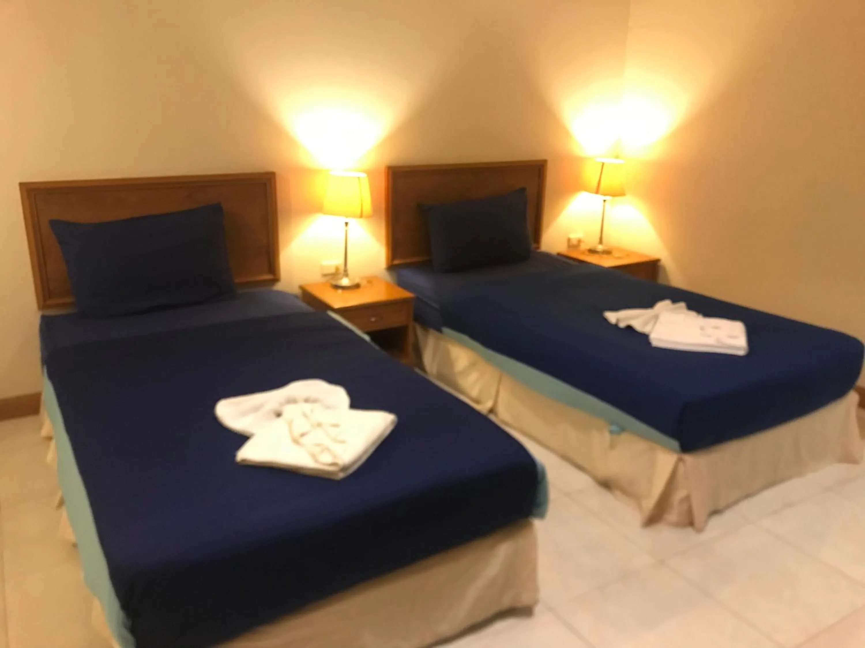 Bed in Global Hotel Beach View