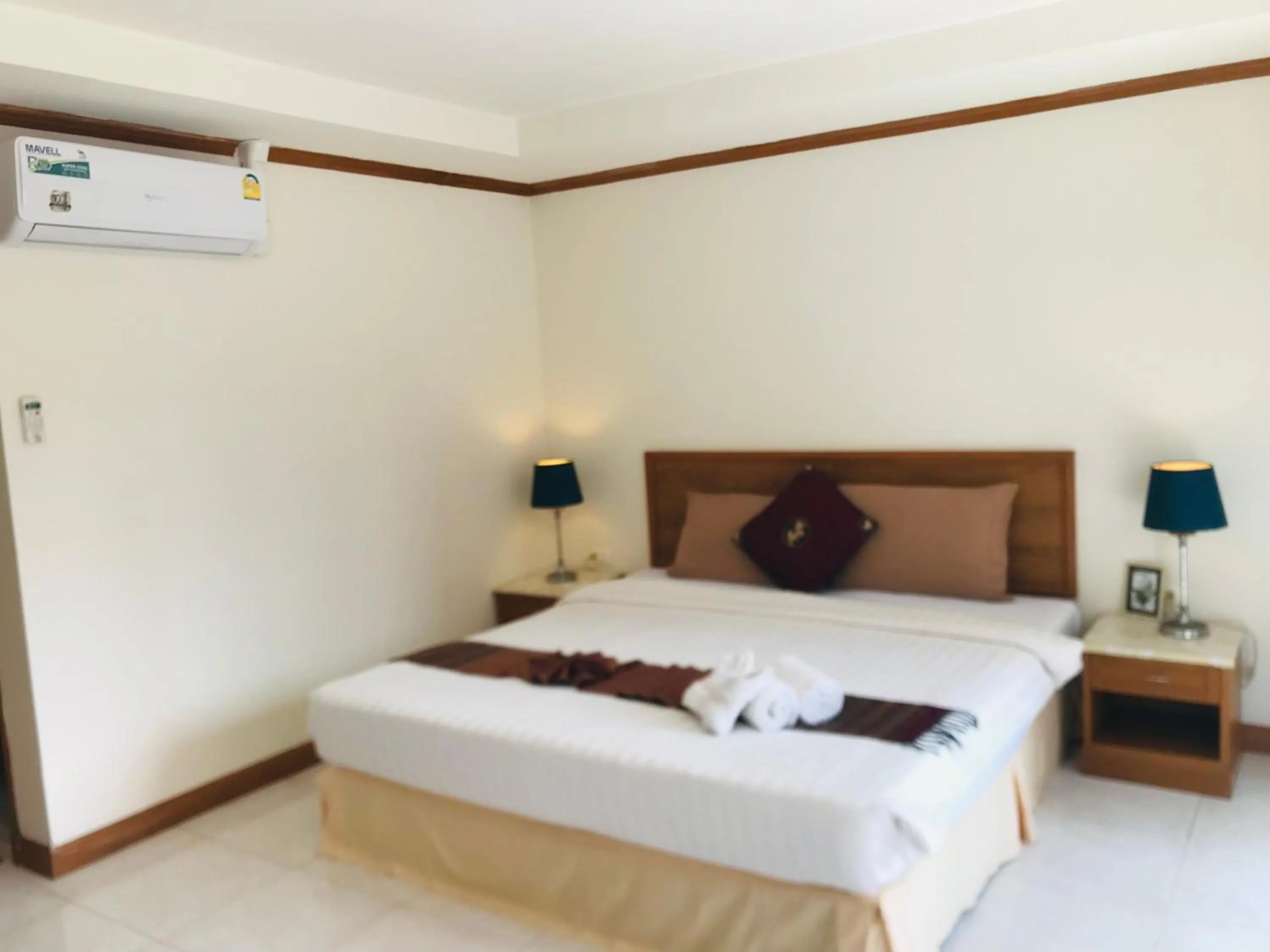 Bed in Global Hotel Beach View