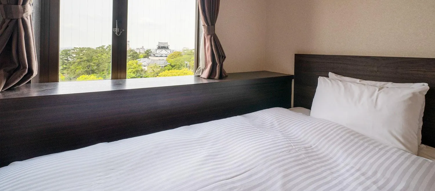 Bed in Okazaki New Grand Hotel