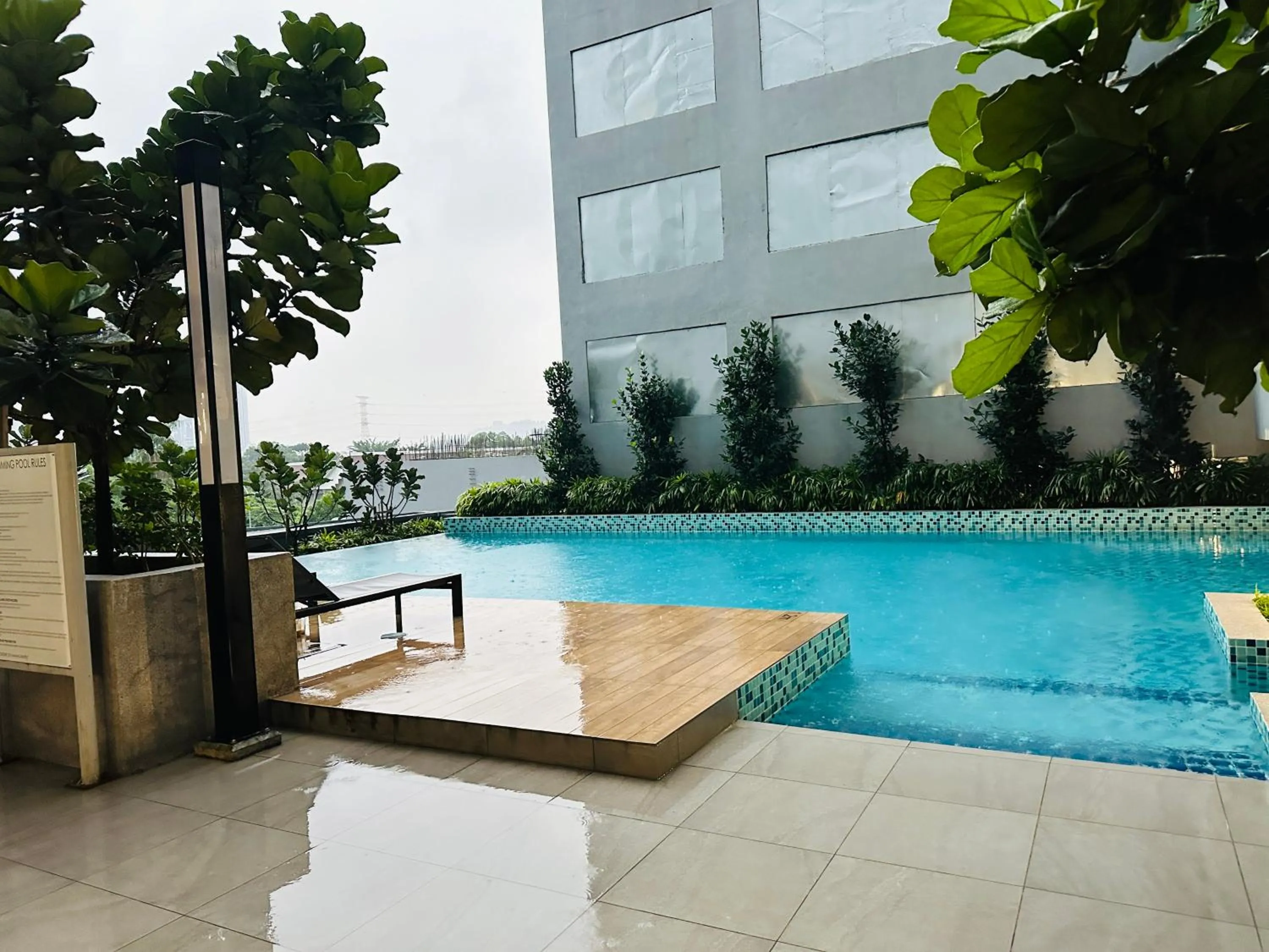 Pool view in Neu Suites Service Apartment By Moonlight