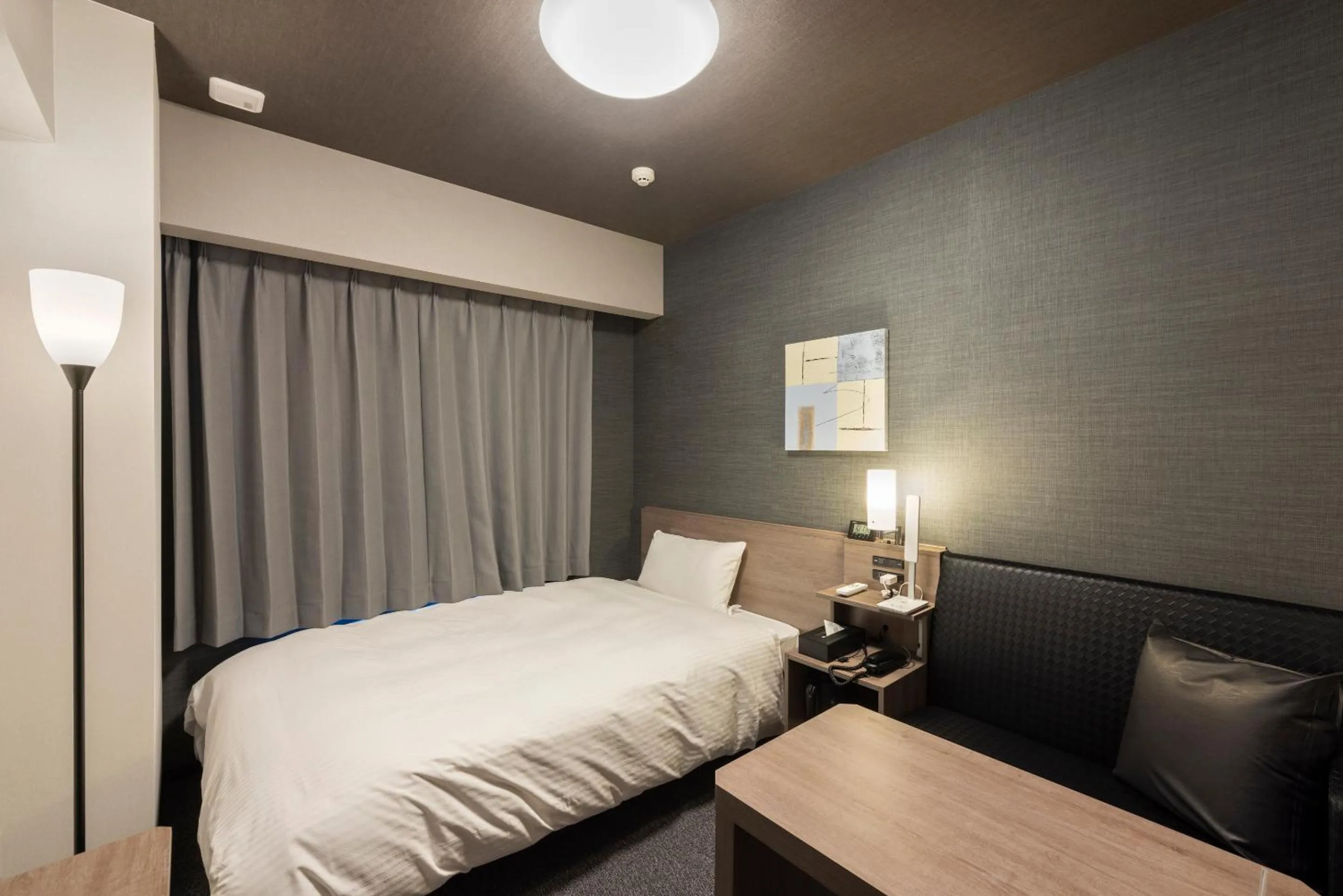 Photo of the whole room, Bed in Hotel Route Inn Grand Nagoya Fujigaoka Ekimae