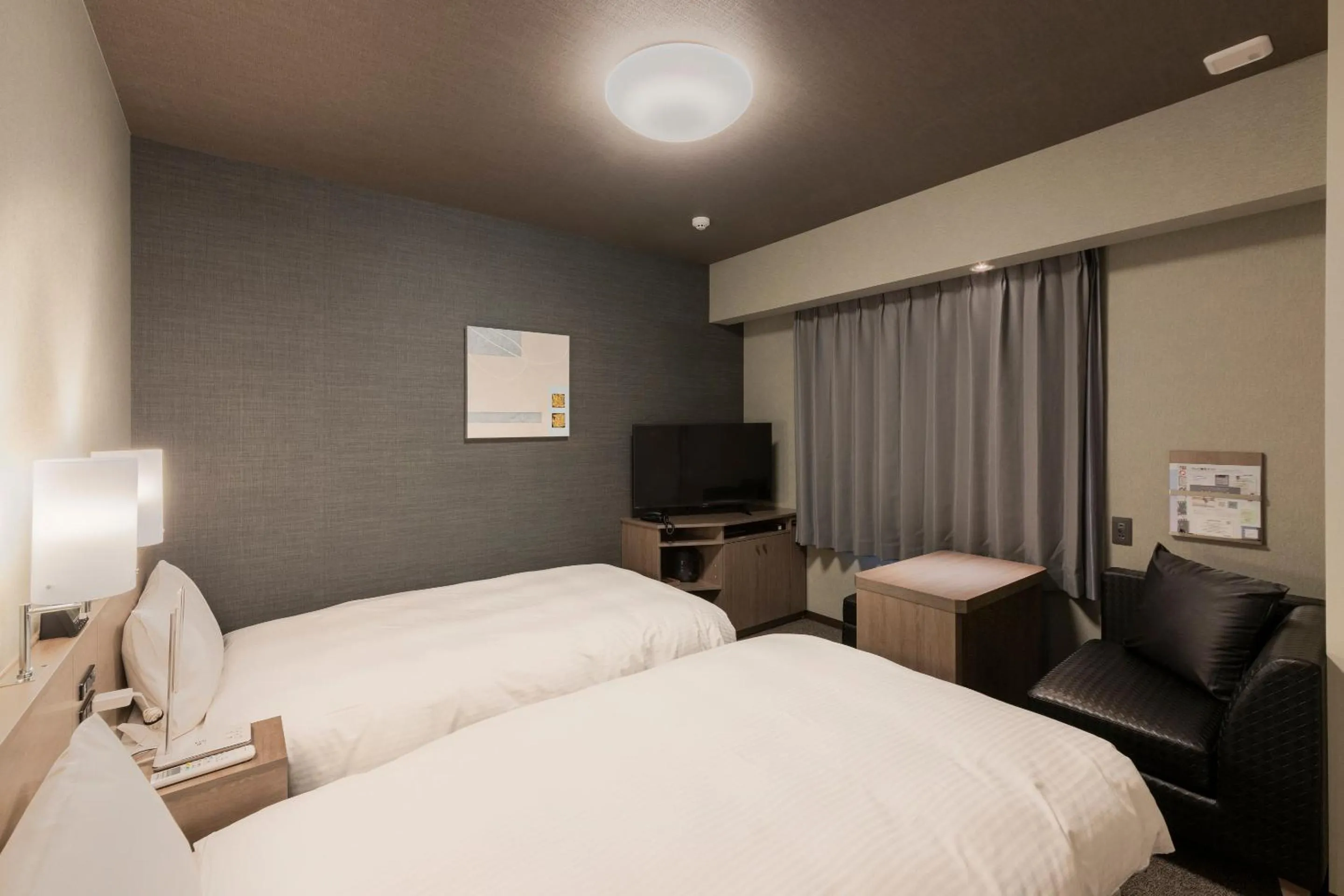 Photo of the whole room, Bed in Hotel Route Inn Grand Nagoya Fujigaoka Ekimae
