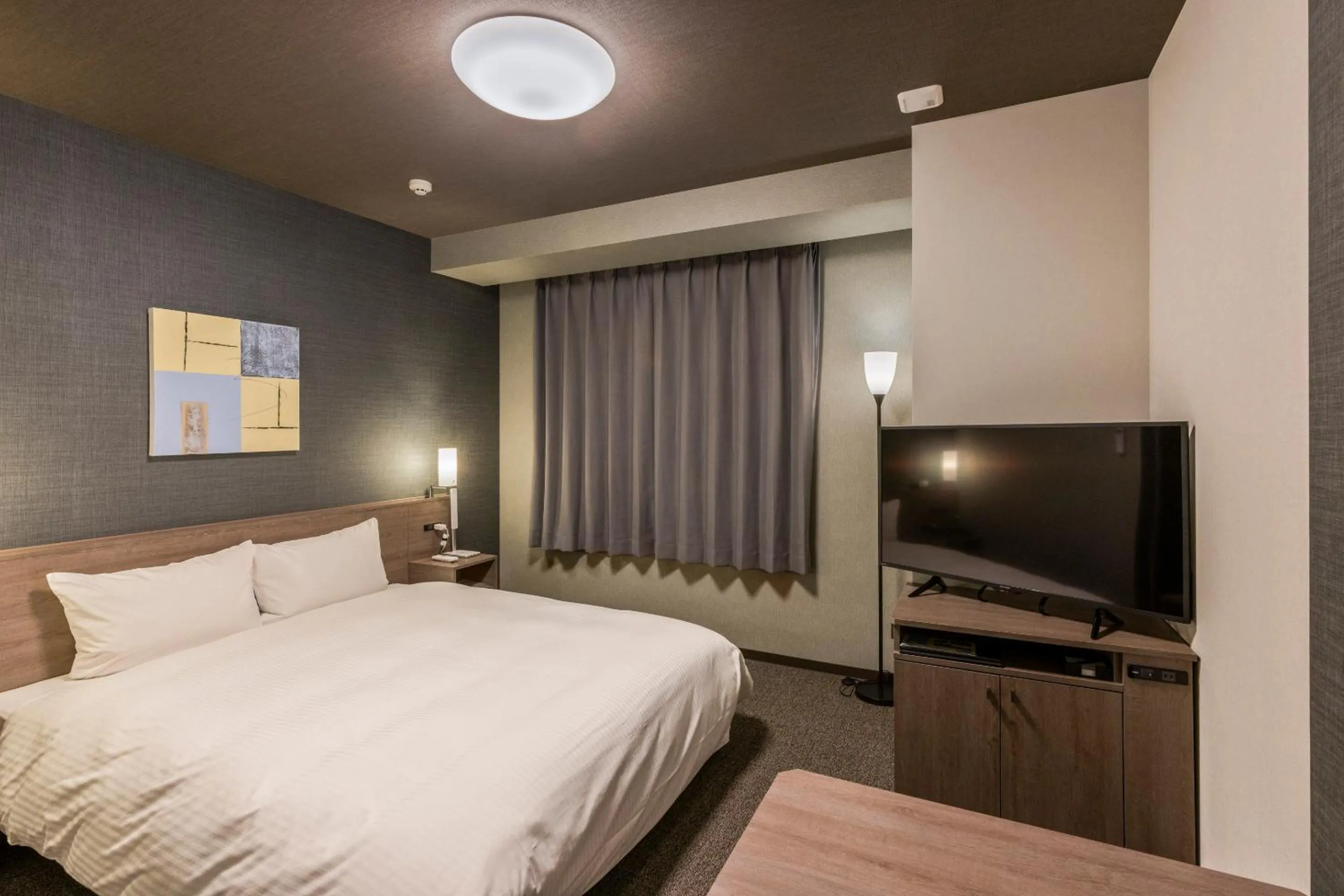 Photo of the whole room, Bed in Hotel Route Inn Grand Nagoya Fujigaoka Ekimae