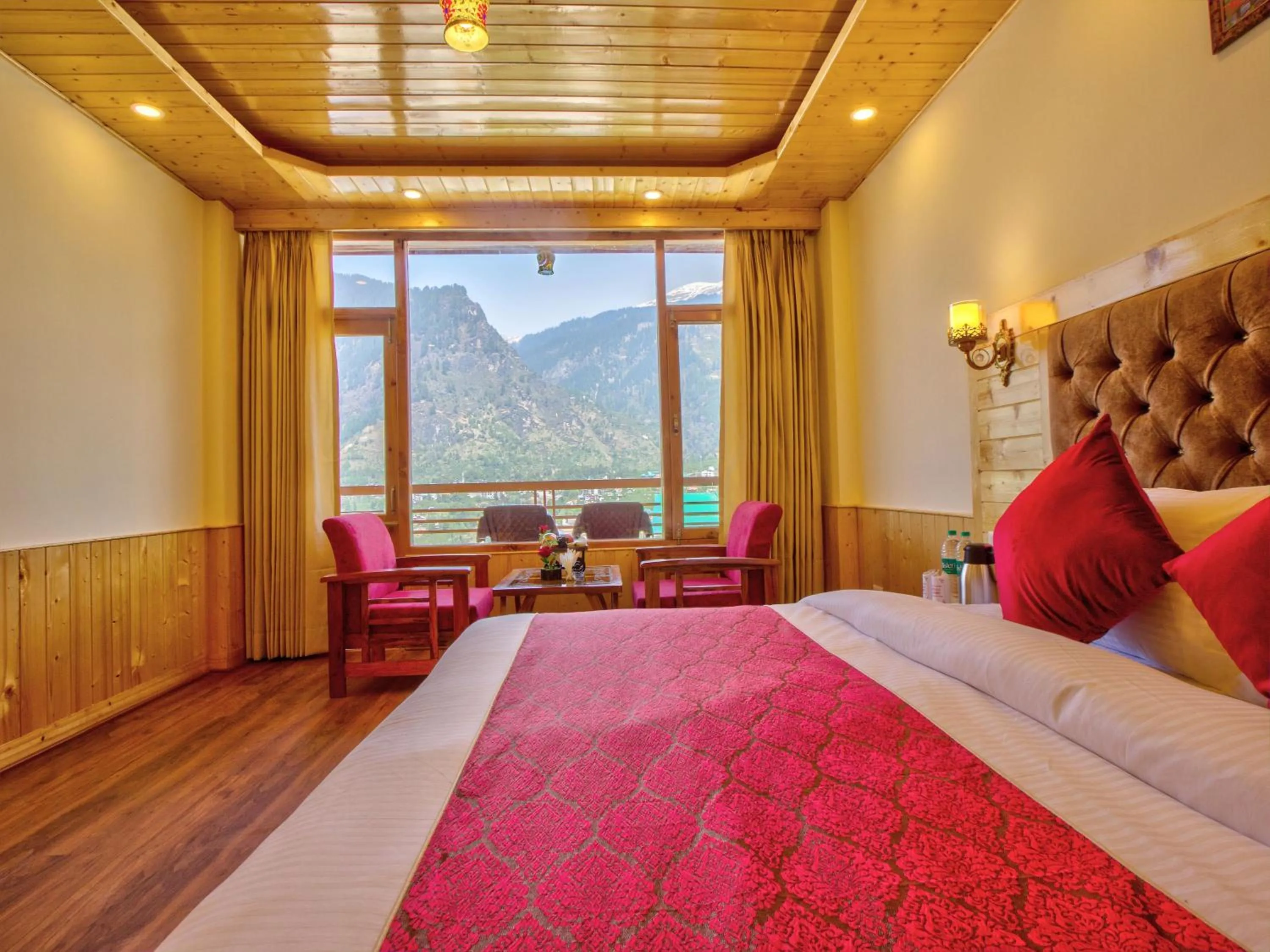 Seating area, Bed in Swastik Grand Manali