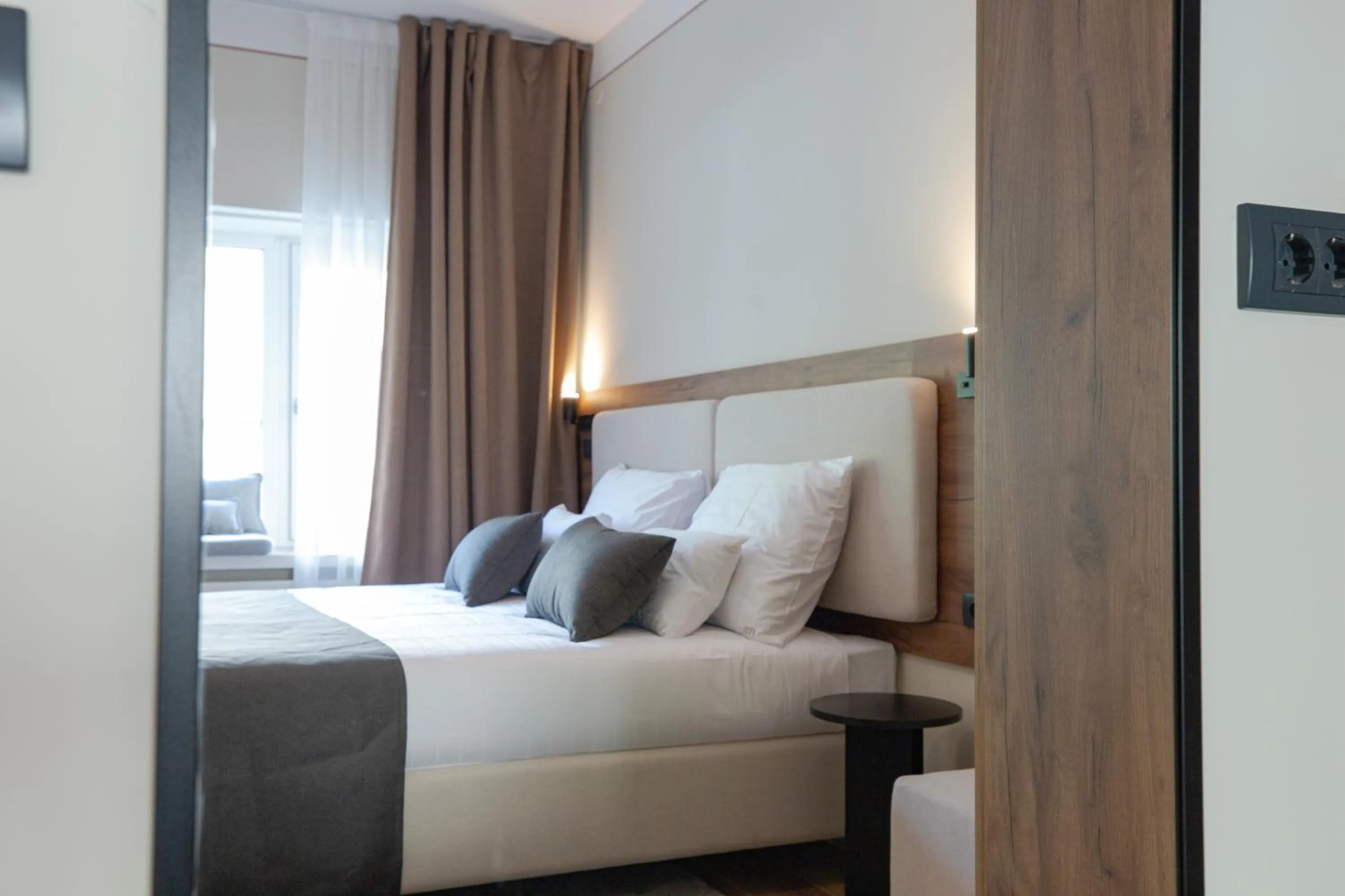 Bed in Simma Luxury Apartments & Rooms