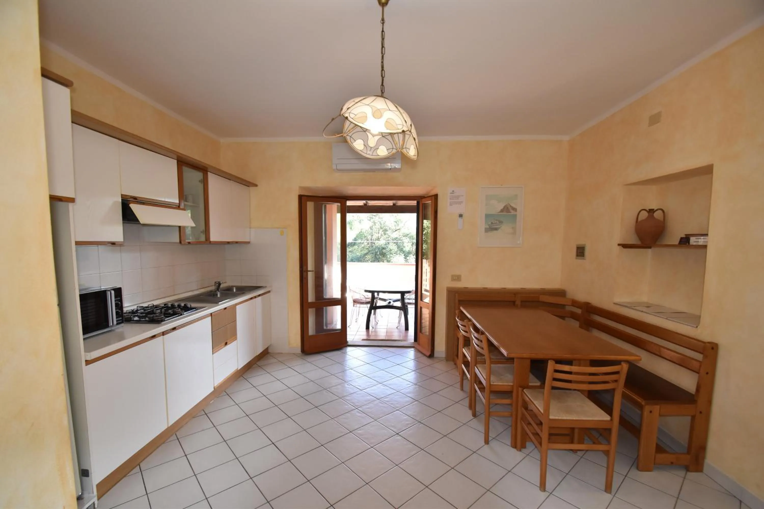 Kitchen or kitchenette in Casa Rosada - Piscina, aria condizionata, terrazze e posti auto