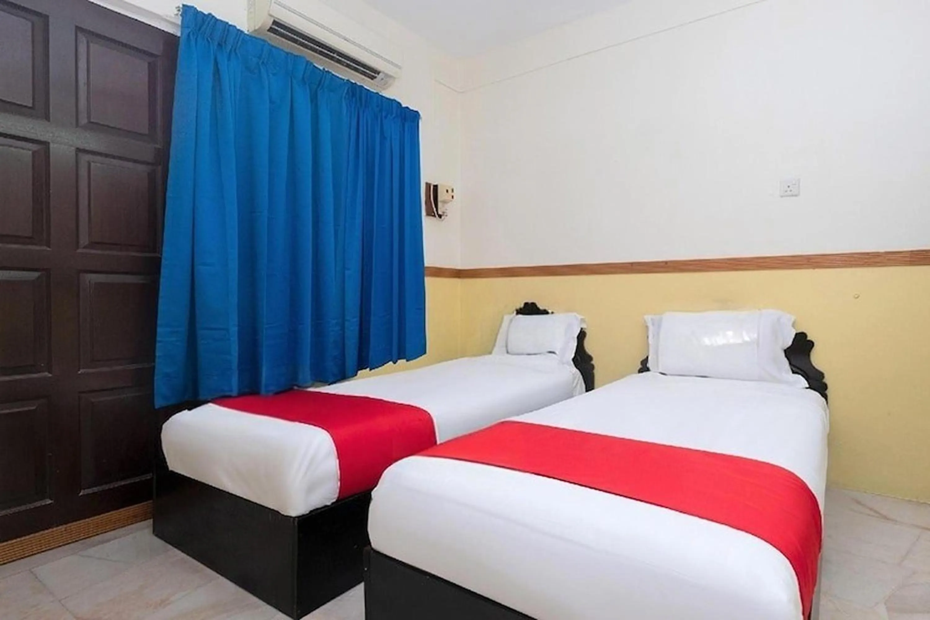 Bed in Lumut Villa Inn