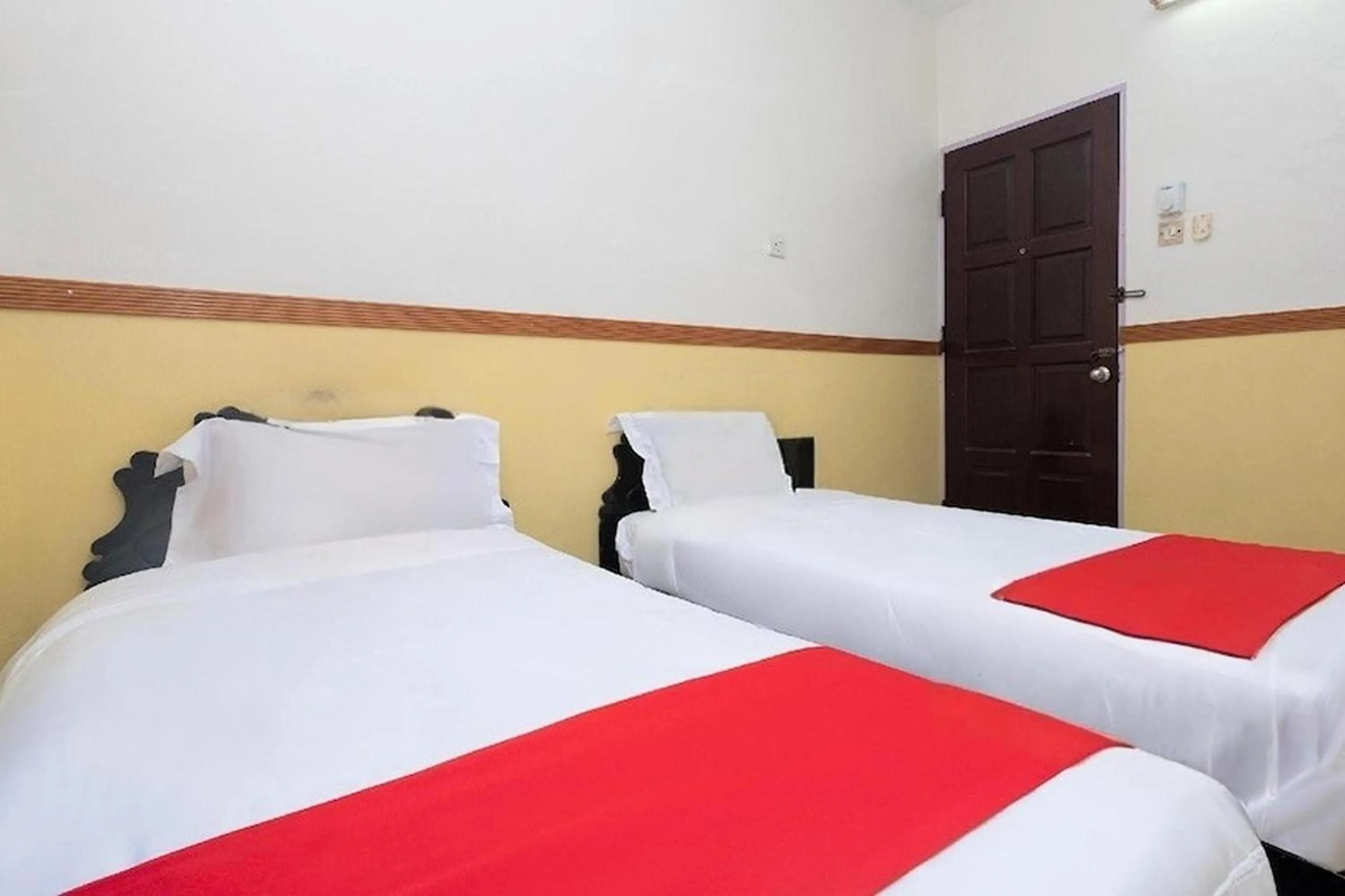 Bed in Lumut Villa Inn