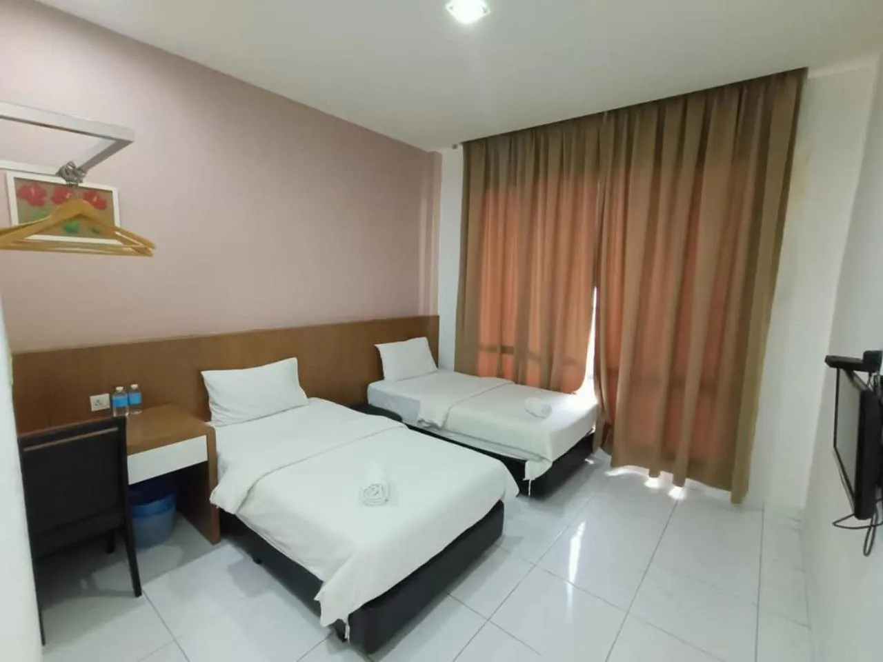 Bed in Hotel Wawasan