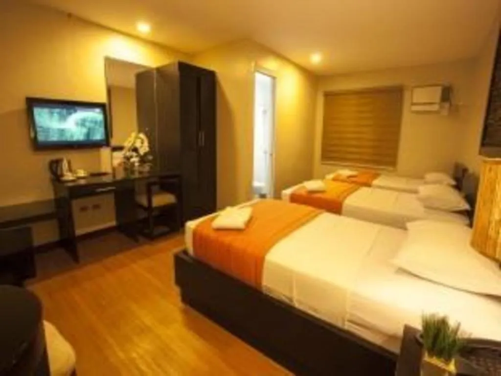 Bed in L Square Hotel