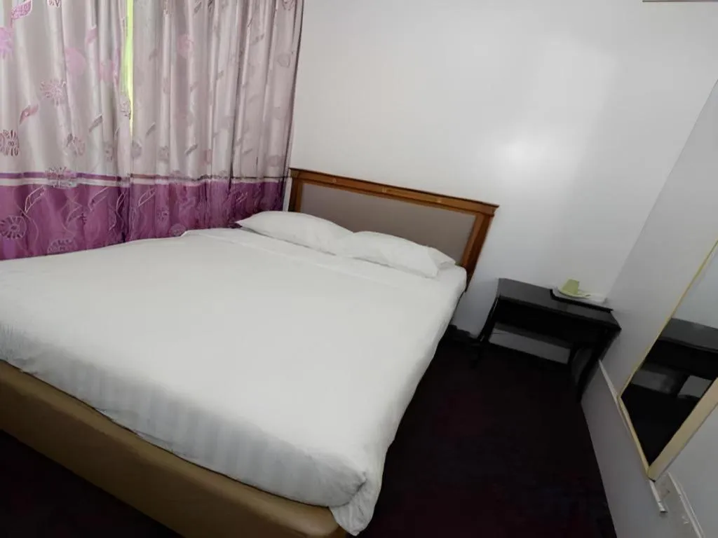 Bed in Meriton Hotel