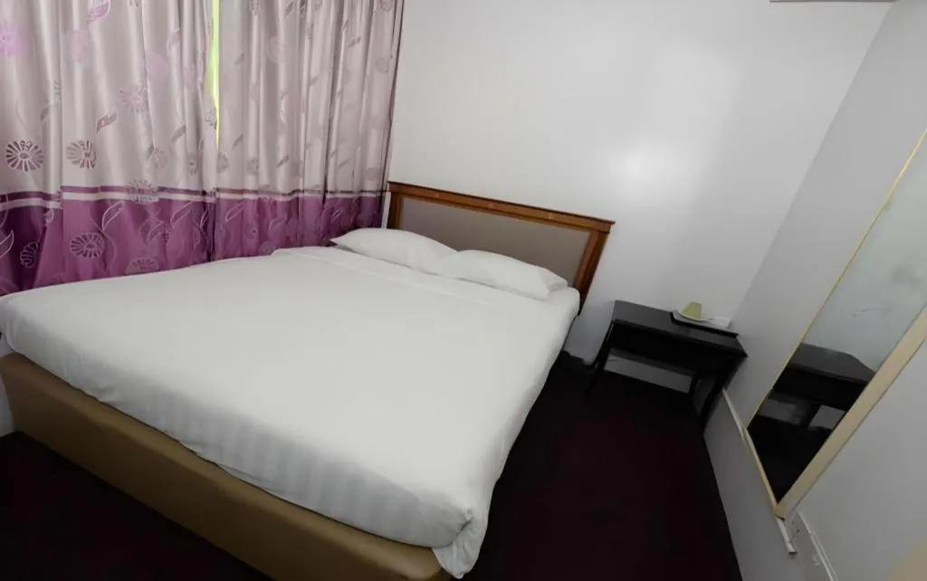 Bed in Meriton Hotel