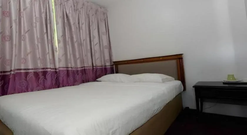 Bed in Meriton Hotel