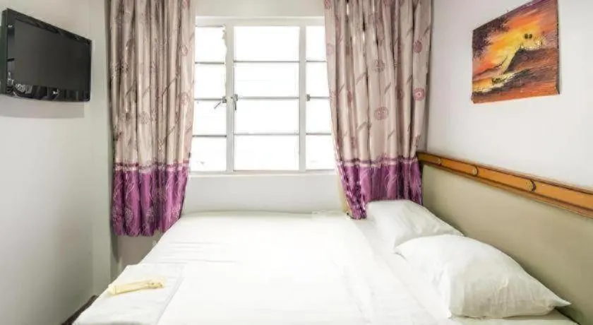 Bed in Meriton Hotel