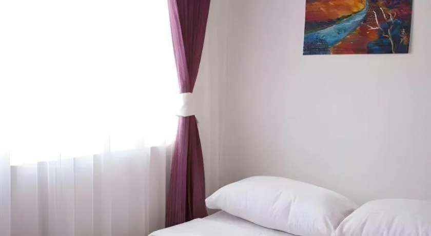 Bed in Meriton Hotel