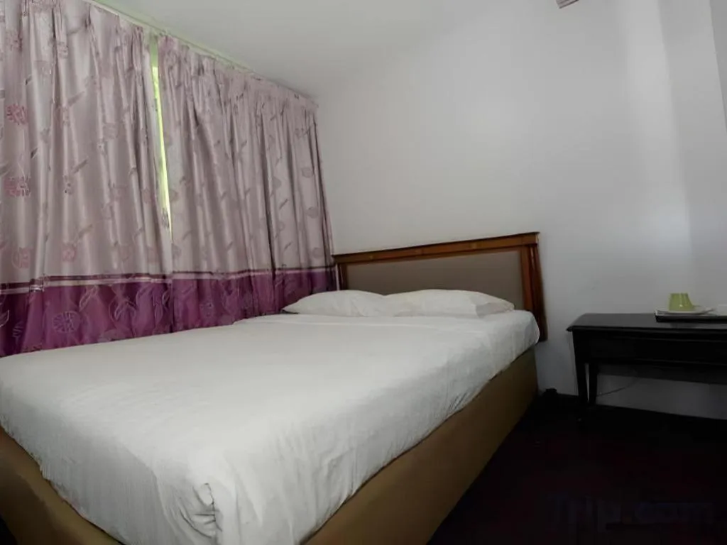 Bed in Meriton Hotel